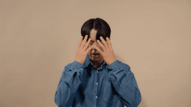 Man in distress covering his face