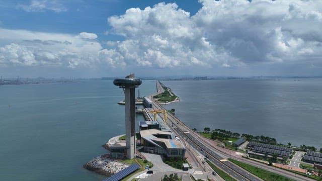 Coastal Highway and High-rise Observation Tower on a Sunny Day