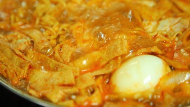Spicy tteokbokki with ramen noodles and egg