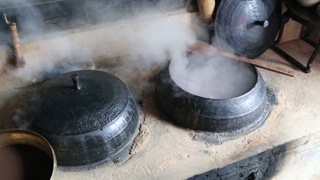 Making Red Bean Porridge with Rice Balls in a Steaming Cauldron