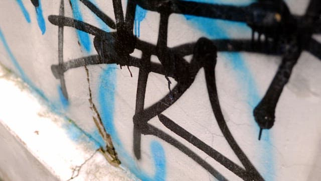 Graffiti on a cracked wall