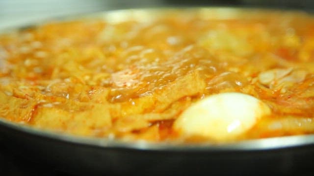 Spicy tteokbokki with ramen boiling in a pot