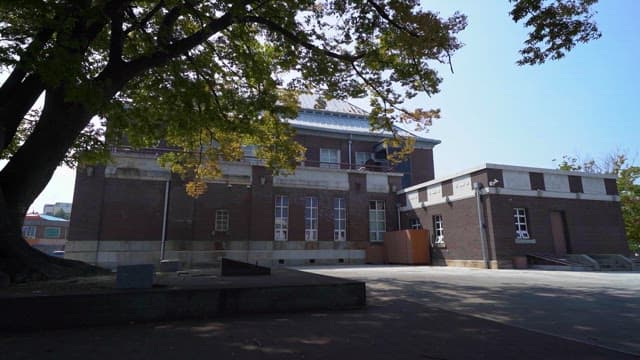 Historical Building and Courtyard on a Clear Day