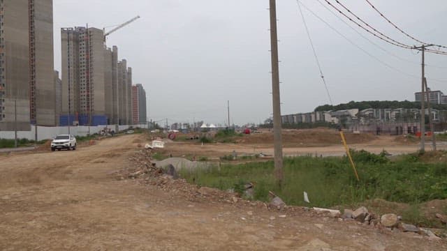 Construction site with high rise buildings during cloudy weather