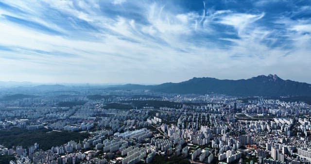 Expansive cityscape with mountains in the background