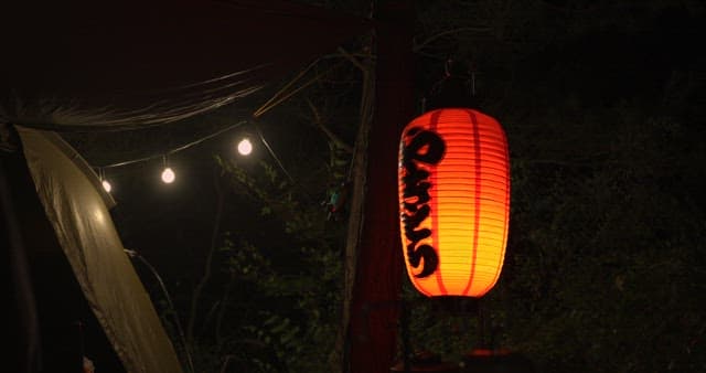 Illuminated Lantern at Nighttime Outdoor Setting