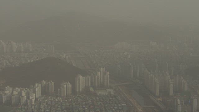 Hazy Cityscape with Dense Residential Blocks
