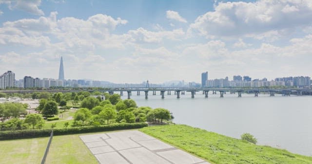 Scenic view of a city with a river and bridge