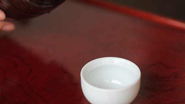 Pouring traditional Korean liquor into a cup