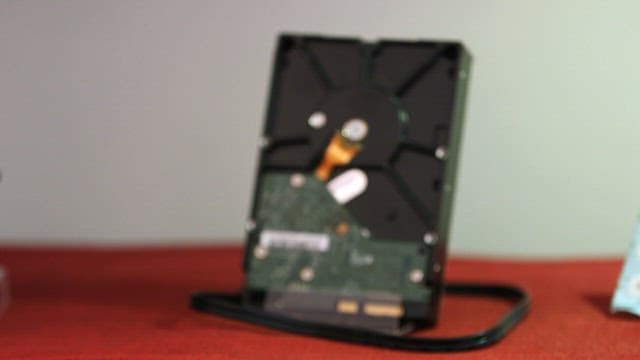 Hard disk drive placed on a red table