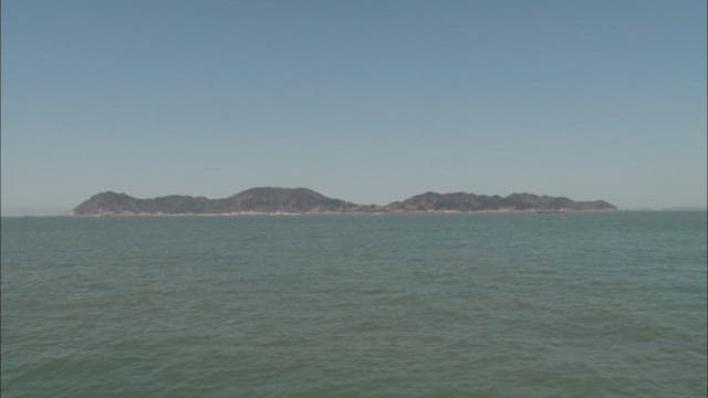 Serene Seascape with Distant island