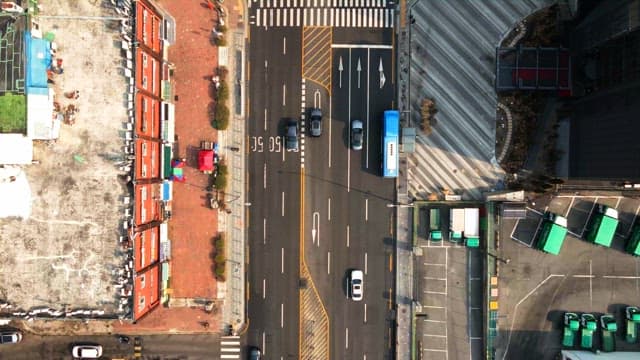 Busy city intersection with traffic from above