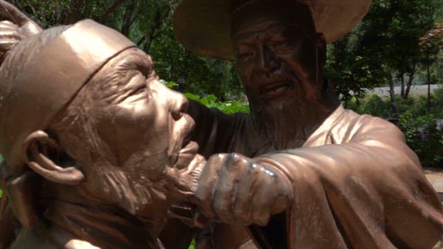 Sculpture of Two People in Dynamic Poses