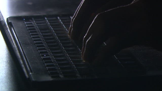 Typing on a keyboard in dim light