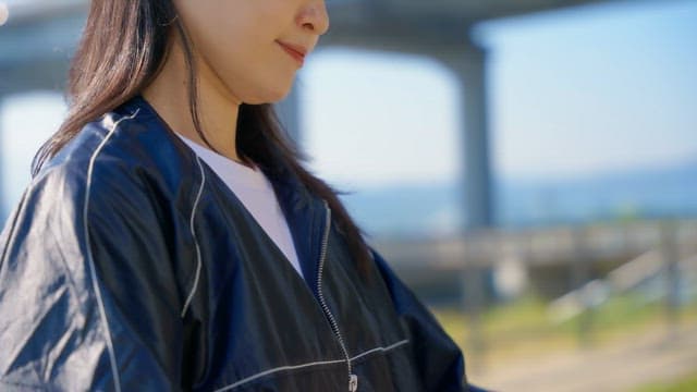 Woman checking smartwatch outdoors