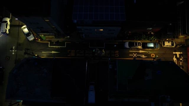 Night city street with cars and pedestrians