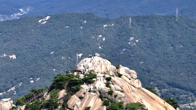 Hikers on a Buramsan mountain peak