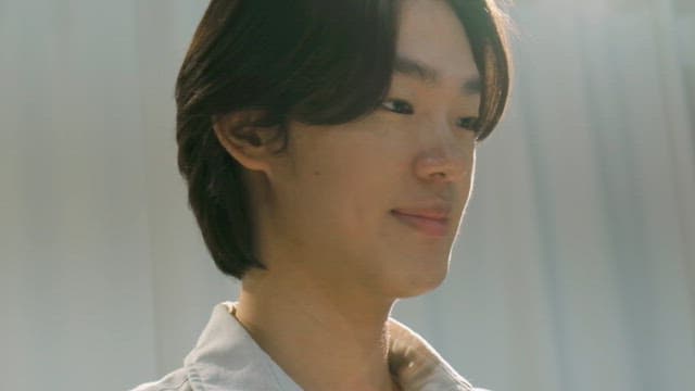 Young man smiling indoors