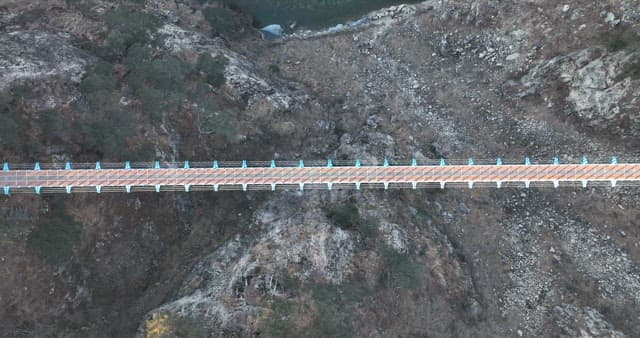 Scenic View of a Suspension Bridge across a Valley
