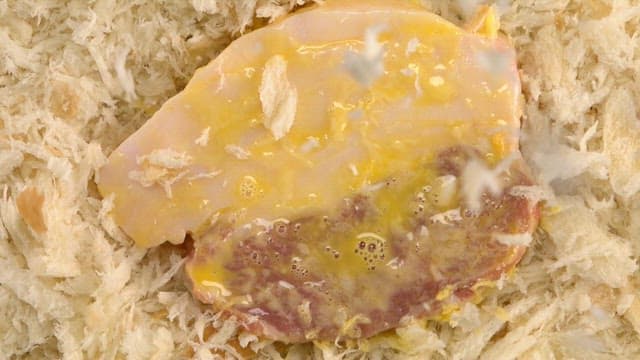 Pork coated with breadcrumbs and egg