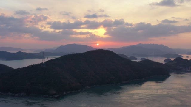 Sunset over a serene mountain landscape