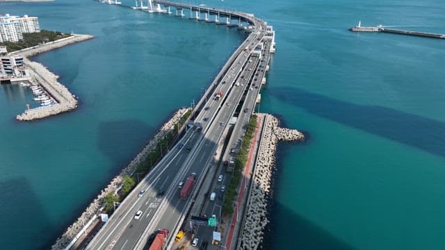 Bridge over the sea with city skyline