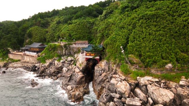 Traditional Korean temple on a coastal cliff