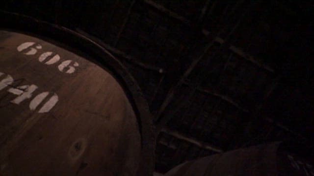 Large Wooden Barrel in a Fdimly Lit Storage Room