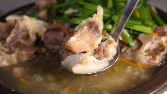 Spoonful of warm and hearty oxtail soup
