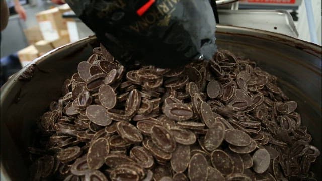 Pouring Chocolate and Cream in a Mixing Bowl