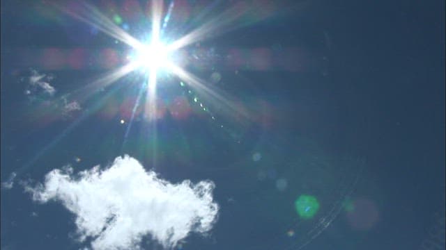 Sunlight Brilliance and Cloud in Clear Blue Sky