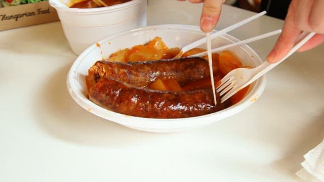 Eating sausages and various snacks bought at the market