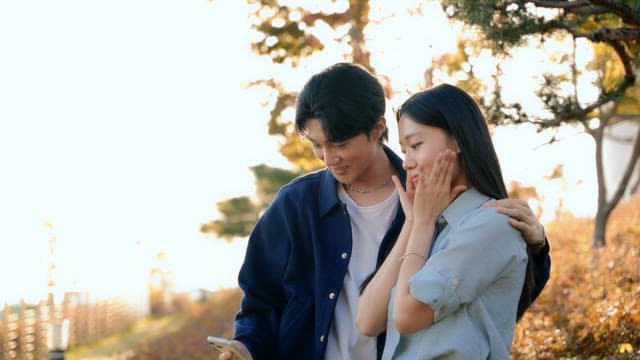 Couple checking selfies taken in the park