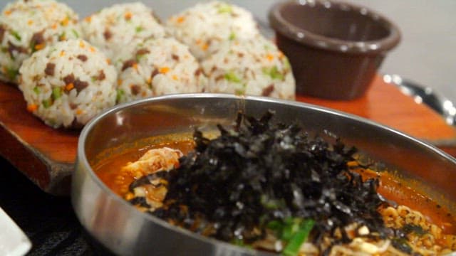 Korean style rice balls and a bowl of spicy ramen