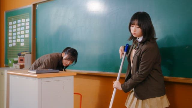 Students cleaning a classroom
